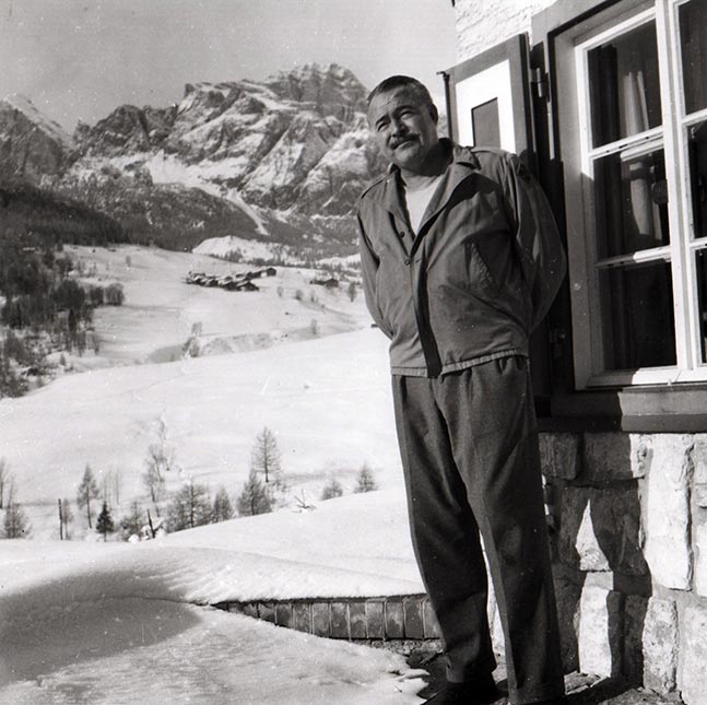 Ernst Hemingway looking in the trunk of his car, Sun Valley, Idaho]